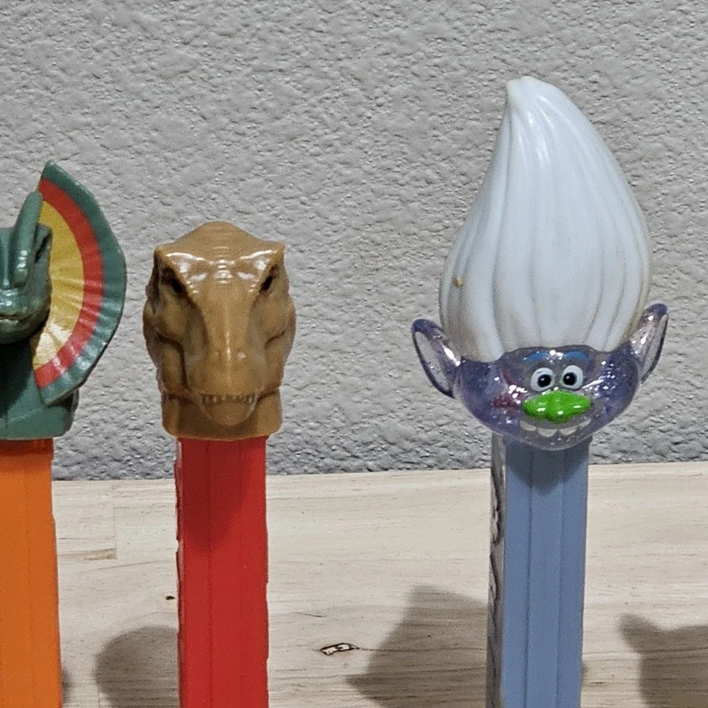 Vintage Pez Dispensers Lot of 7 Jurrasic Park, Daffy, Trolls, Emoji, Easter